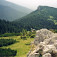 Červenec s chatou a nad nimi vrch Mních