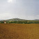 Vrch Piliš od východu, v popredí kostol v M. Bare