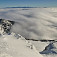 Priam rozprávková inverzia, z ktorej trčia len Nízke Tatry a samotár Veľký Choč